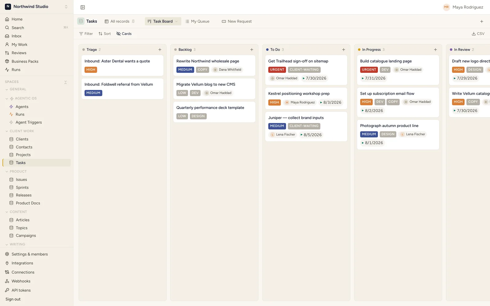A StoryOS task board full of work — colored priorities, labels and assignees