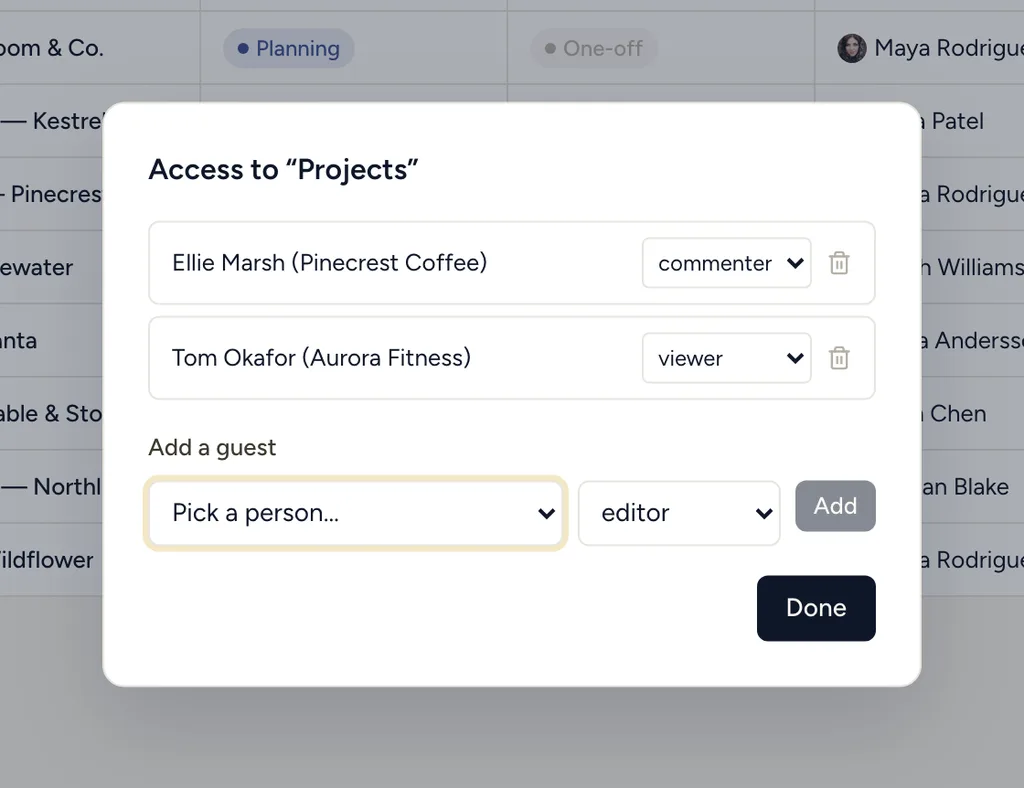 The StoryOS access dialog granting two client guests scoped viewer and commenter roles